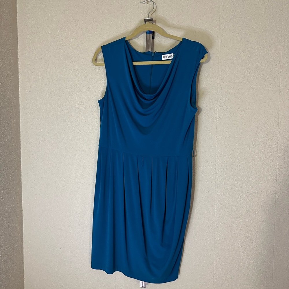 Teal sleeveless dress.